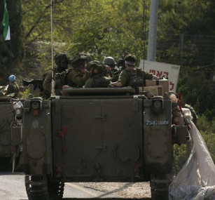 Press review: IDF shrinking before Gaza maze and Kiev flogs 'peace formula' but buyers few