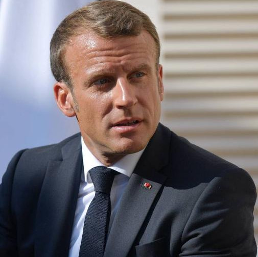 Macron calls for reviewing ties with Russia